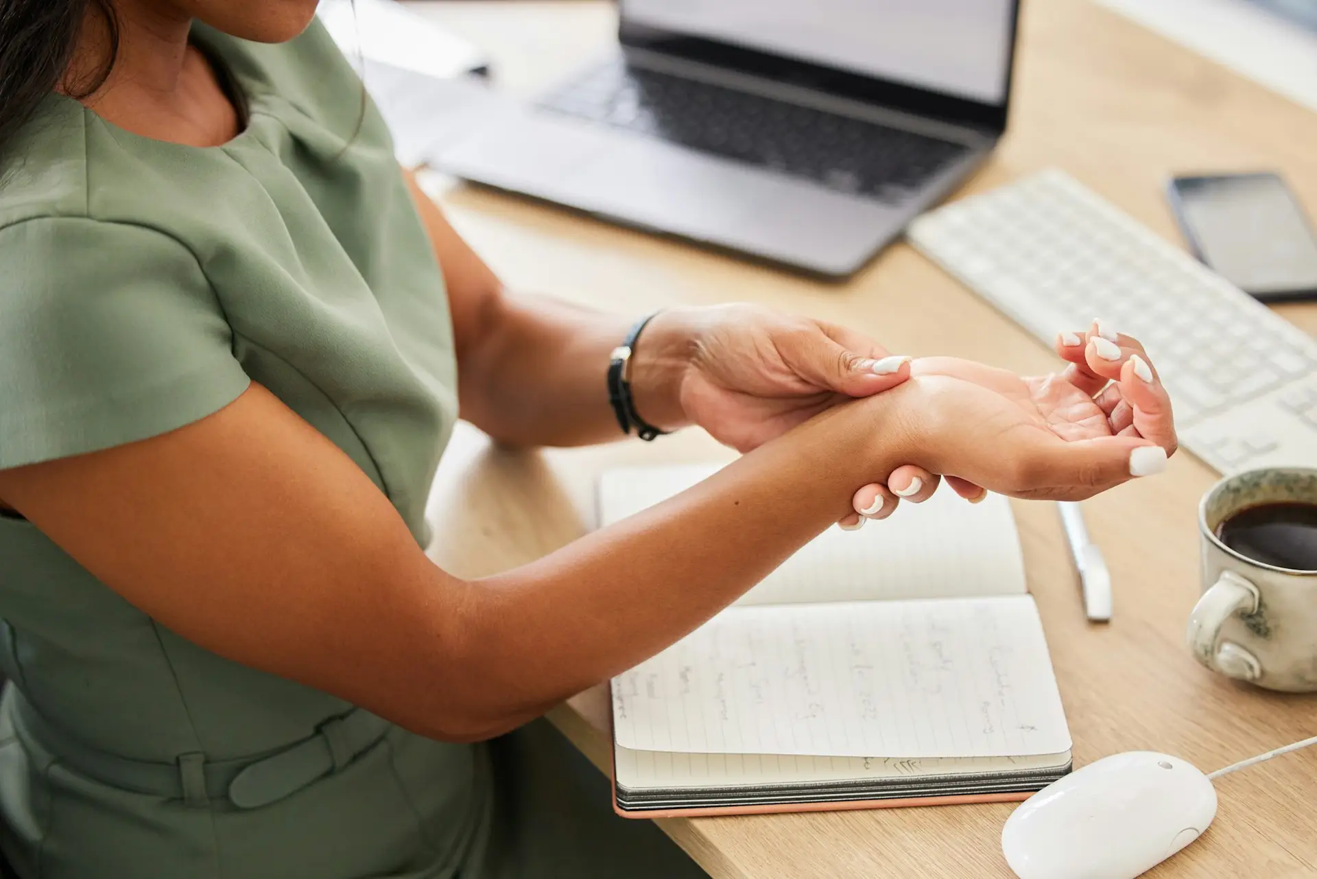 Business woman, wrist injury and pain from osteoporosis, orthopedic joint and working in office. Fe